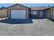 A charming single-Gathering home with gravel landscaping and a one car garage at 1130 N Leslie St, Pahrump, NV 89060