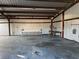 The interior of a metal garage with worktables set up inside at 1130 N Leslie St, Pahrump, NV 89060