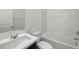Bathroom with bright white tiling, vanity with sink, and shower/tub combo at 98 Via Franello, Henderson, NV 89011