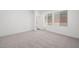 Spacious carpeted bedroom with neutral walls and large windows, ready for personalization at 98 Via Franello, Henderson, NV 89011