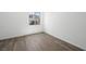 An empty room features a window view, neutral paint, and tile flooring at 98 Via Franello, Henderson, NV 89011
