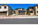 Charming home featuring desert landscaping, brick paved driveway, and two-car garage at 98 Via Franello, Henderson, NV 89011