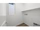 Laundry room includes window, shelf, and utility connections, ready for appliances at 98 Via Franello, Henderson, NV 89011
