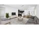 Open concept living room with kitchen, dining area, and contemporary furnishings at 98 Via Franello, Henderson, NV 89011