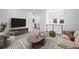 Bright living room boasts neutral tones, modern furnishings, and great natural light at 98 Via Franello, Henderson, NV 89011