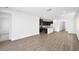 Spacious living room with tile flooring, neutral walls, and views into the kitchen at 98 Via Franello, Henderson, NV 89011