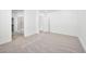 Main bedroom featuring neutral carpet, white walls, and ensuite bathroom at 98 Via Franello, Henderson, NV 89011