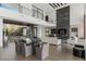 Open concept dining area with glass table and modern chairs at 9 Boulderback Dr, Henderson, NV 89012