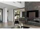 Modern living room featuring a sleek fireplace and high ceilings at 9 Boulderback Dr, Henderson, NV 89012