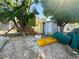 Exterior backyard shot with mature trees, partially dissembled play structure, and potential for outdoor enjoyment at 3895 Mountain Trl, Las Vegas, NV 89108