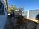 Backyard featuring a fire pit and shed with ample space for outdoor activities at 3895 Mountain Trl, Las Vegas, NV 89108