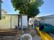 Backyard featuring ample storage space with mature trees providing ample shade at 3895 Mountain Trl, Las Vegas, NV 89108