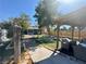 Backyard featuring mature trees, patio area, and covered gazebo at 3895 Mountain Trl, Las Vegas, NV 89108