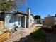 A single-story home with a backyard and partial view of a storage building at 3895 Mountain Trl, Las Vegas, NV 89108