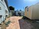 The backyard boasts a brick-paved patio, a trailer and an external building at 3895 Mountain Trl, Las Vegas, NV 89108