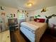 Cheerful bedroom with playful wall decorations, wooden floors, and natural light at 3895 Mountain Trl, Las Vegas, NV 89108