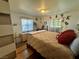 Cheerful bedroom with playful wall decorations, wooden floors, and natural light at 3895 Mountain Trl, Las Vegas, NV 89108