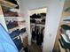 Organized closet with shelves and hanging space for clothes and accessories at 3895 Mountain Trl, Las Vegas, NV 89108