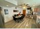 Dining room featuring a modern table set, ceiling fan and vinyl floors at 3895 Mountain Trl, Las Vegas, NV 89108