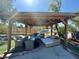 Outdoor gazebo with comfortable seating and ambient lighting at 3895 Mountain Trl, Las Vegas, NV 89108