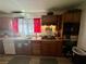 View of kitchen sink and counter area, oven, stove top and stainless steel microwave at 3895 Mountain Trl, Las Vegas, NV 89108