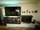 Bright living room with a large mounted television set above a sleek storage console at 3895 Mountain Trl, Las Vegas, NV 89108