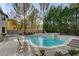 Refreshing pool with spacious deck and surrounding landscaping at 4156 Balmoral Castle Ct, Las Vegas, NV 89141