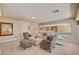 Shows a sitting room with a view into another room and comfortable seating at 4156 Balmoral Castle Ct, Las Vegas, NV 89141