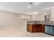 Modern kitchen area with granite counters and an open layout into the living space at 8752 Younts Peak Ct, Las Vegas, NV 89178