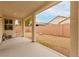 Covered patio area leading to a gravel backyard enclosed by a brick wall at 8752 Younts Peak Ct, Las Vegas, NV 89178