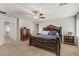 Bedroom featuring carpeted floors, ceiling fan, and dresser at 8351 Gold River Ct, Las Vegas, NV 89113