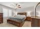 Bedroom featuring carpeted floors, ceiling fan, and lamps at 8351 Gold River Ct, Las Vegas, NV 89113