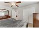 Bedroom with ceiling fan and carpeted floors at 8351 Gold River Ct, Las Vegas, NV 89113