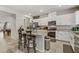 Modern kitchen with white cabinets, granite countertops, and island at 8351 Gold River Ct, Las Vegas, NV 89113