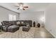 Living room with sectional sofa and ceiling fan at 8351 Gold River Ct, Las Vegas, NV 89113