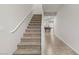 Carpeted staircase leading to the upper level, overlooking a game room at 8351 Gold River Ct, Las Vegas, NV 89113