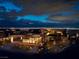 Contemporary home with illuminated landscaping offering city views at night at 12 Chisel Crest Ct, Henderson, NV 89012