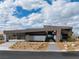 Contemporary home with minimalist design, desert landscaping, and a welcoming front entrance at 12 Chisel Crest Ct, Henderson, NV 89012