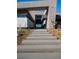 Stairway leads to a modern home entrance with desert landscaping and unique architectural design at 12 Chisel Crest Ct, Henderson, NV 89012