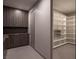 Walk-in pantry with custom shelving, cabinetry, and ample storage space at 12 Chisel Crest Ct, Henderson, NV 89012