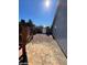 Gravel backyard with flagstone patio and gate at 2802 Camelback Ln, Henderson, NV 89074