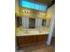 Double vanity bathroom with wood cabinets and a large mirror at 2802 Camelback Ln, Henderson, NV 89074