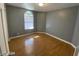 Bedroom with hardwood floors and an arched window at 2802 Camelback Ln, Henderson, NV 89074