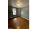 Bedroom with hardwood floors and an arched window at 2802 Camelback Ln, Henderson, NV 89074