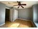 Bright bedroom with ceiling fan and wood flooring at 2802 Camelback Ln, Henderson, NV 89074