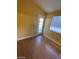 Bright bedroom with wood flooring and sliding glass door at 2802 Camelback Ln, Henderson, NV 89074