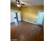 Bright bedroom with wood flooring, ceiling fan, and sliding glass door at 2802 Camelback Ln, Henderson, NV 89074