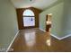 Bright dining room with hardwood floors and arched window at 2802 Camelback Ln, Henderson, NV 89074