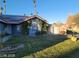 House exterior with solar panels and landscaped yard at 2802 Camelback Ln, Henderson, NV 89074