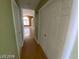 Long hallway with light walls and wood flooring at 2802 Camelback Ln, Henderson, NV 89074